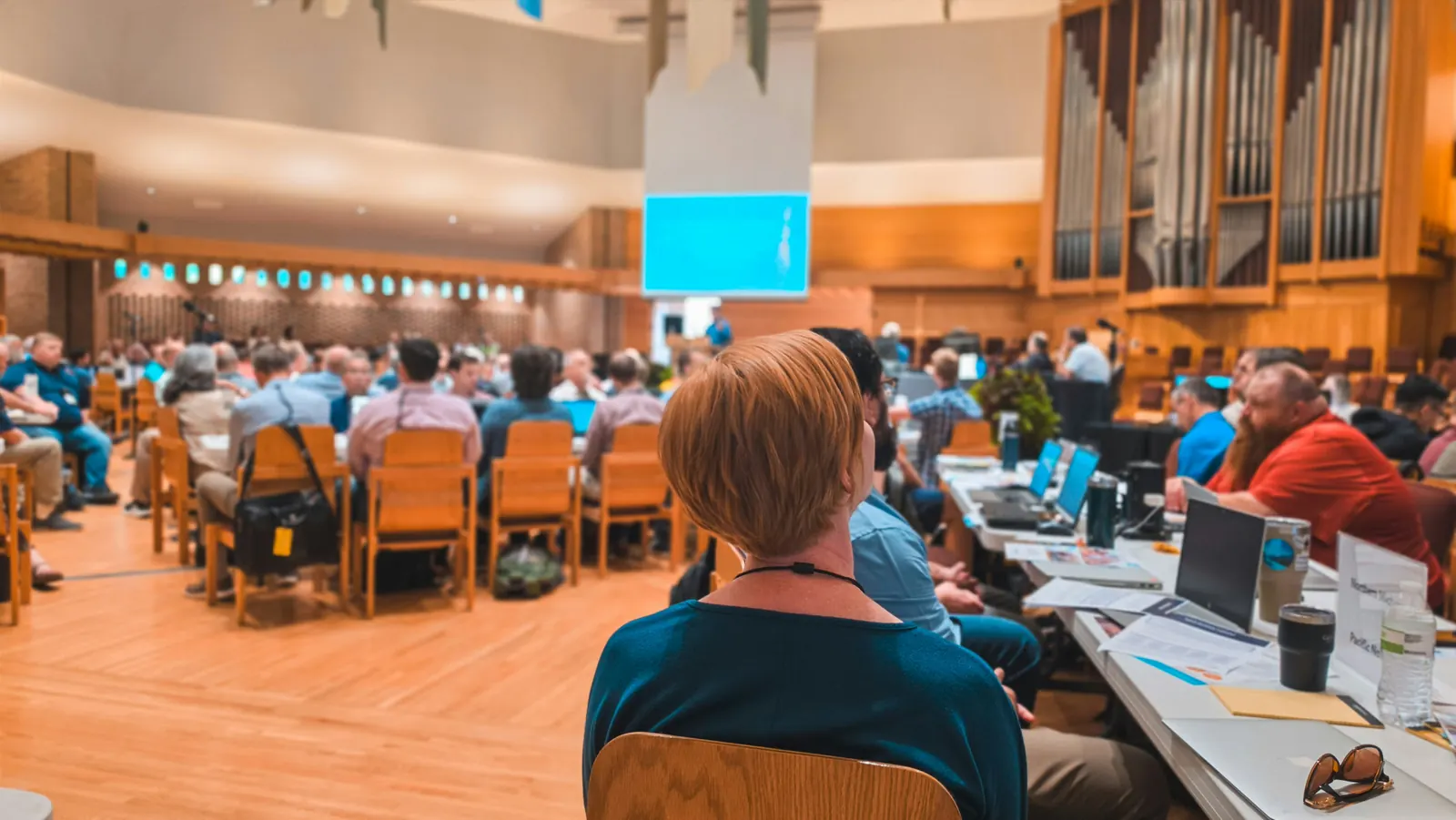 Attendee listening during a corporate conference and event